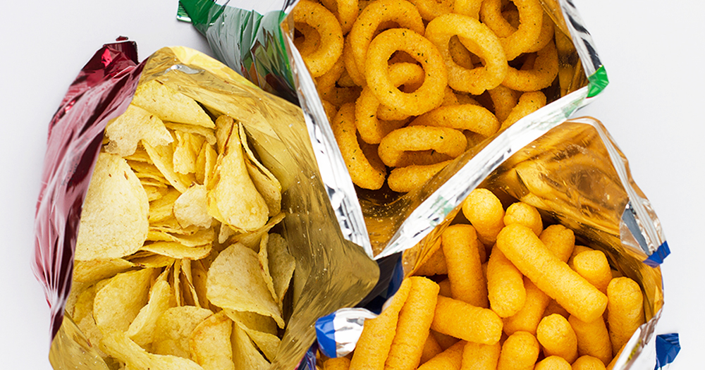 top view of three open bags of chips of different sizes, colors and textures